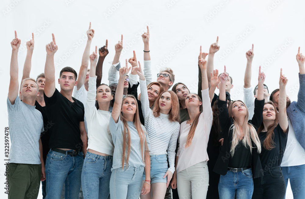 group of serious young people where pointing up group of serious young people where pointing up