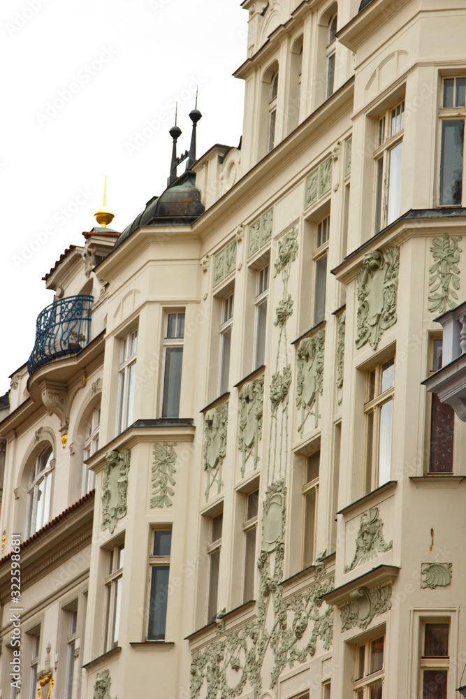 Prague, Czech Republic. 10.05.2019: Close-up view of the facade with windows of old historical buildings in Prague. Retro, old-fashioned, vintage, last century.