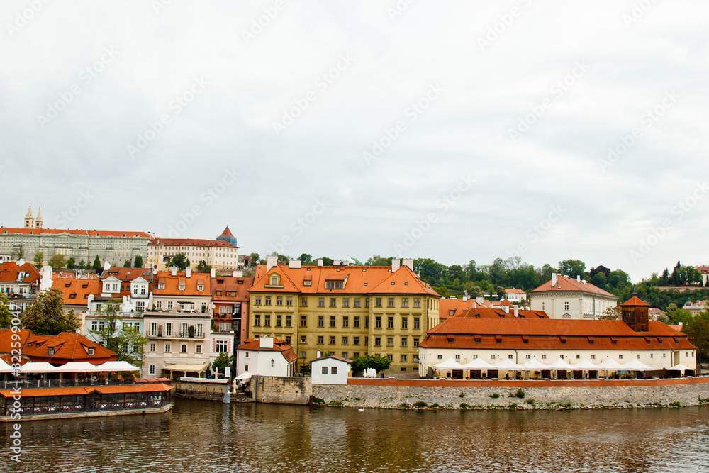 Prague. 05.10.2019: Orange colored roof tops of Prague old town buildings and baroque style houses viewed from top of old town hall tower, Prague, Czech Republic. Panorama.
