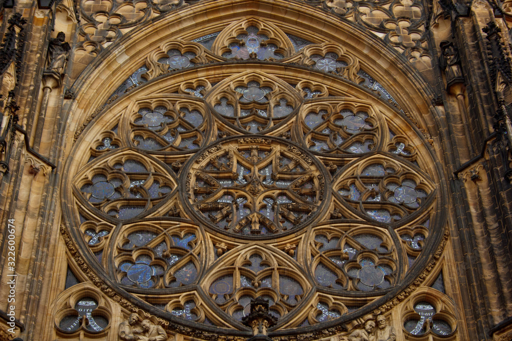 Prague. 10.05.2019: Detailed view on gothic mosaic round window of St. Vitus cathedral in Prague Castle in Prague, Czech Republic.