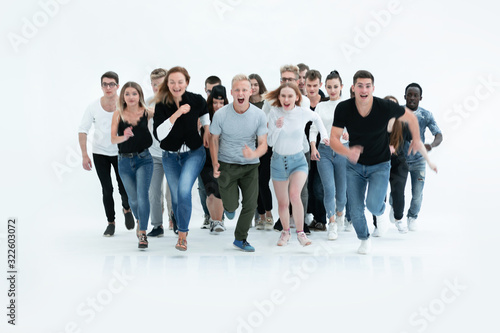 Photography in full growth. smiling young people hurrying to their goal