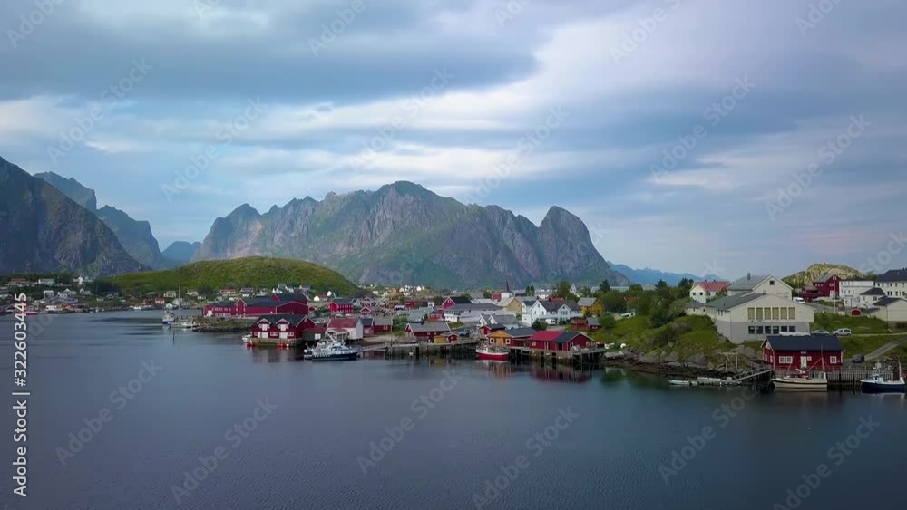 Aerial view of picturesque fishing town of Reine on Lofoten islands in Norway, popular tourist destination on sunny summer day. Aerial 4k Aerial view of picturesque fishing town of Reine on Lofoten islands in Norway, popular tourist destination on sunny summer day. Aerial 4k