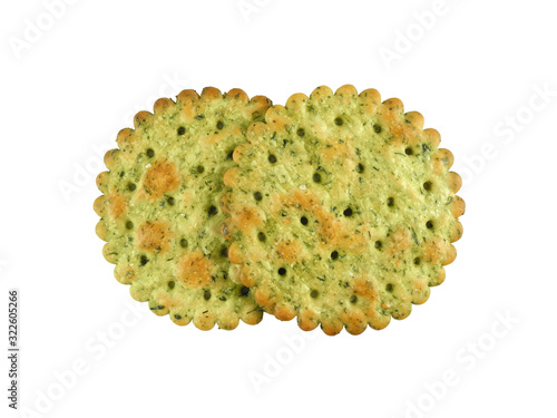 Round crispy cracker with herbs, two pieces closeup isolated on white background