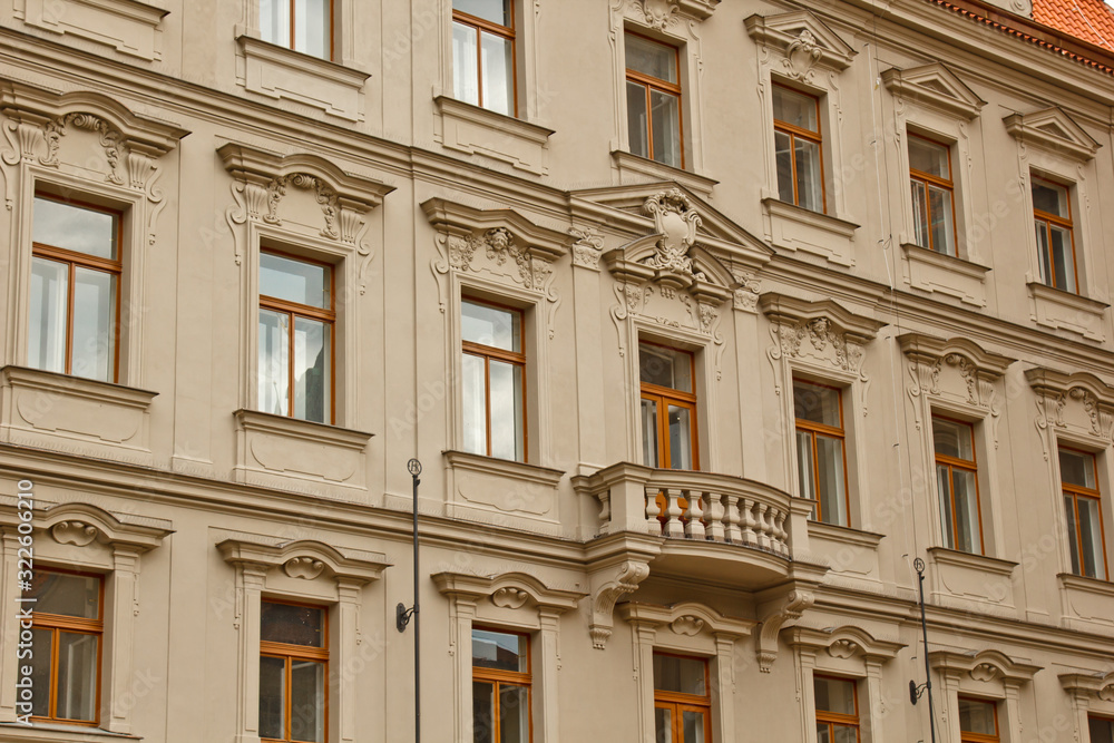 Prague, Czech Republic. 10.05.2019: Close-up view of the facade with windows of old historical buildings in Prague. Retro, old-fashioned, vintage, last century.