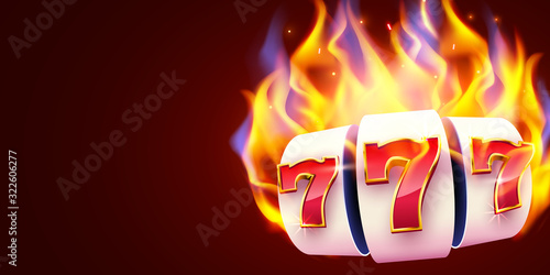 Burning slot machine wins wins the jackpot. Fire casino concept. Hot 777