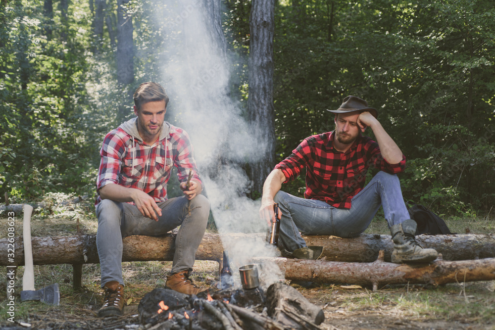 Young people having a camping. Happy young friends having picnic in the country. Weekend. Friends couples enjoy vacation or weekend forest. Young people having a camping. Happy young friends having picnic in the country. Weekend. Friends couples enjoy vacation or weekend forest.