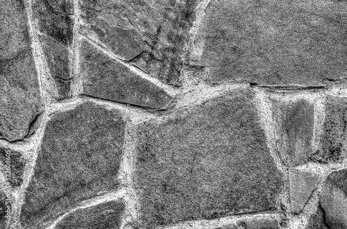 Stone wall background in black and white close up view