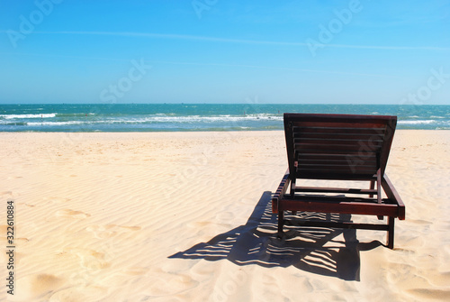 Fototapeta Naklejka Na Ścianę i Meble -  Beautiful beach. Chairs on the sandy beach near the sea. Summer holiday and vacation concept for tourism. Inspirational tropical landscape