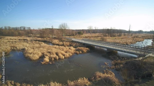 Bridge on the river Grabia in the city of Marzenin, Poland photo