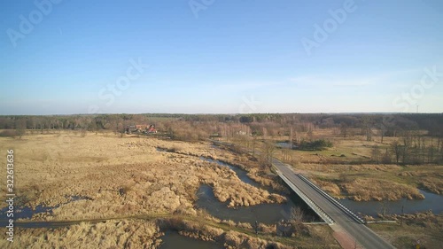 Bridge on the river Grabia in the city of Marzenin, Poland photo