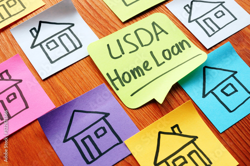 USDA home loan and drawn homes on a paper. photo