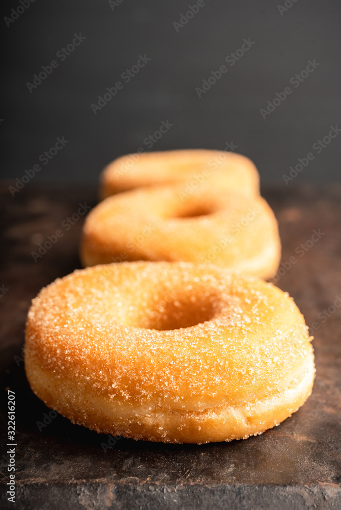 Donut with apple jam on the rustic background. Selective focus.