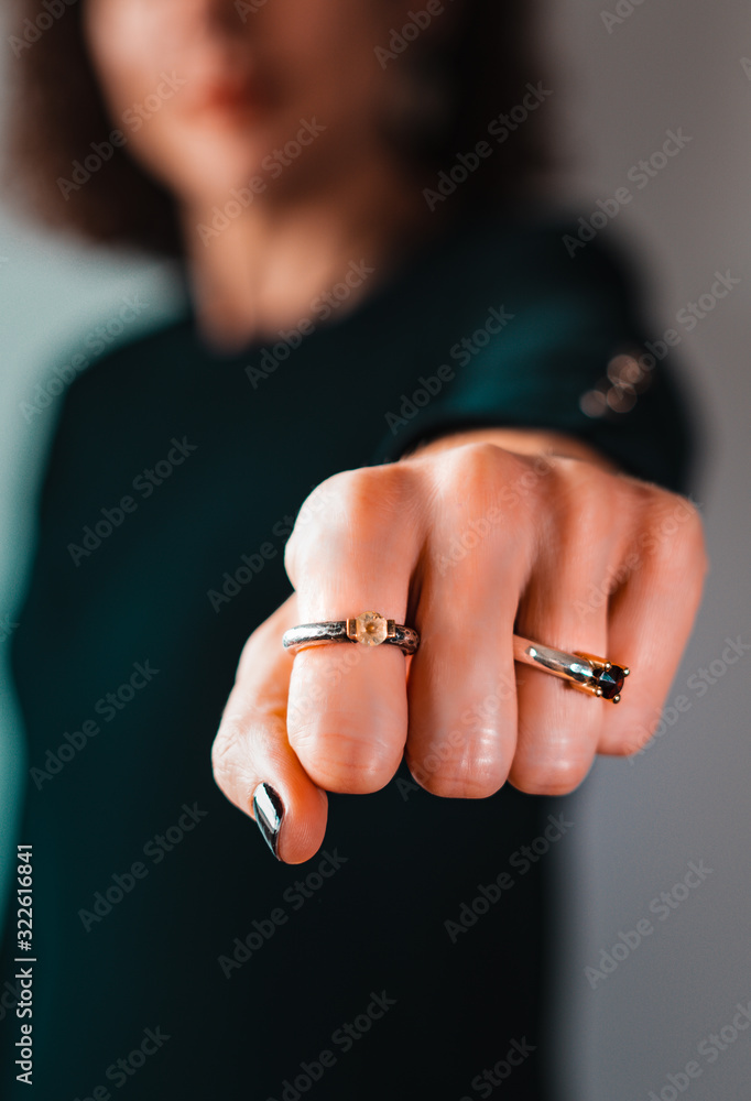 Blurred woman standing over white isolated background Punching fist to fight, feminism, girl power and angry attack, threat and violence. Selective focus Blurred woman standing over white isolated background Punching fist to fight, feminism, girl power and angry attack, threat and violence. Selective focus