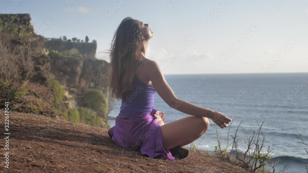 Woman in lotos pose on mountain. Yoga scene. 4k Woman in lotos pose on mountain. Yoga scene. 4k