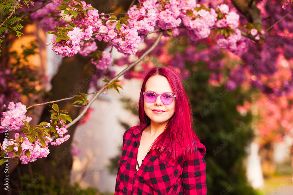 Portrait of young model with sakura bloom Portrait of young model with sakura bloom