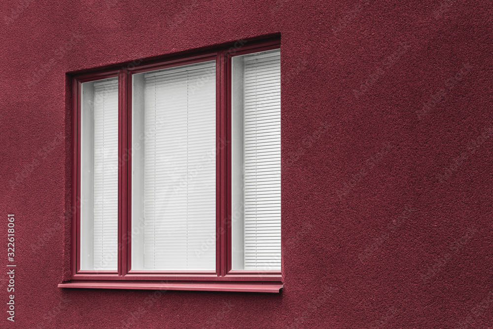 Fototapeta premium Window of a cherry red building