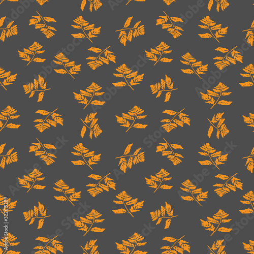 Illustration of orange carved fall leaves isolated on a gray background, Seamless pattern