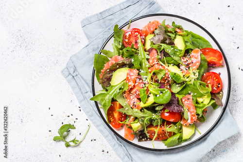 Salmon salad on white top view.
