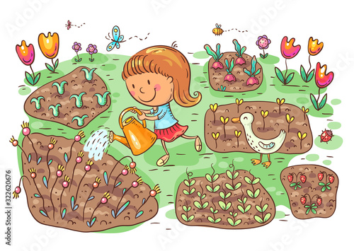 Child watering flowers and vegetables in the garden