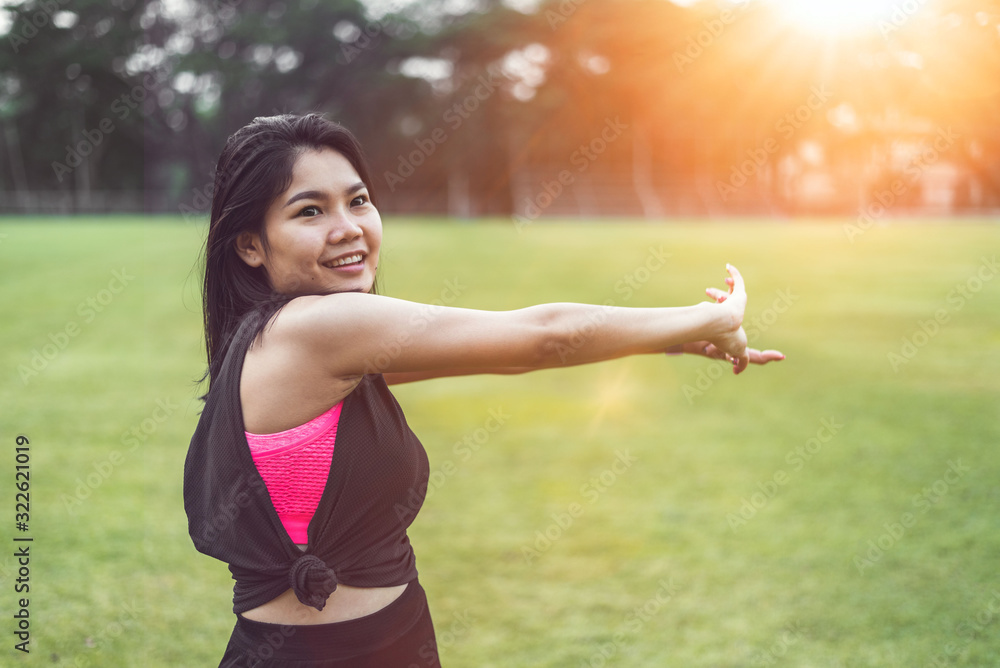 Women perform exercises by focusing on their hands and arms before exercising in the park. Women perform exercises by focusing on their hands and arms before exercising in the park.