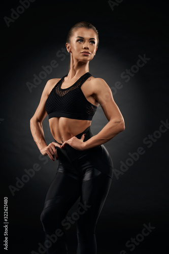 Fitnesswoman posing in sportswear. © serhiibobyk