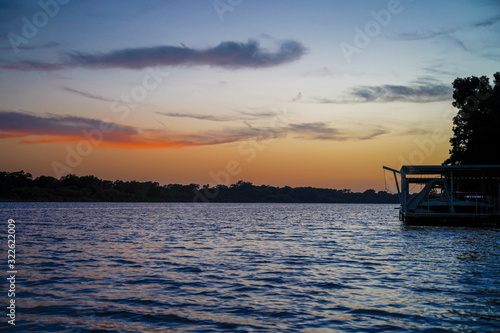 Sun sets over Lake Marble Falls, Texas. 
