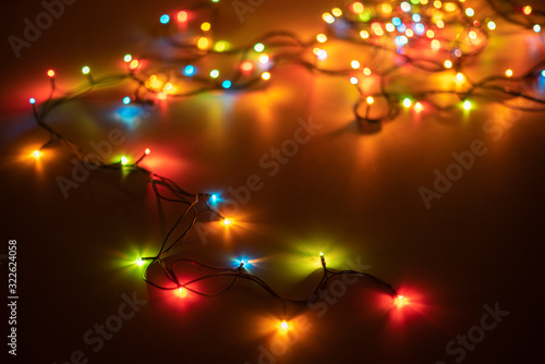 electric wire messy garland on the color surface of table in dark place