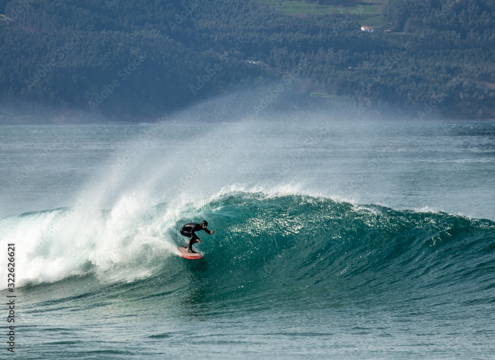 Getting barreled surfing