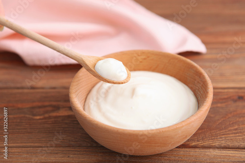 Natural white yogurt on the table. Healthy snack  Greek yogurt.