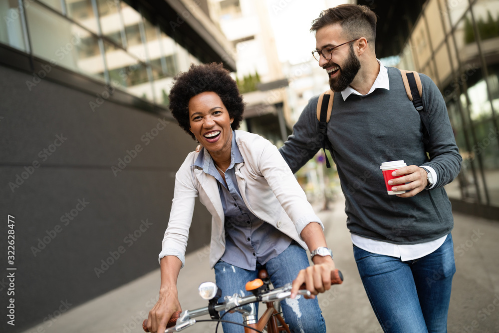 Happy business people, students having fun, smiling, talking in the city