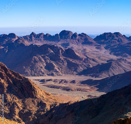 Egypt. Bedouin village. Mount Sinai in the morning in the bright sun. (Mount Horeb, Gabal Musa, Moses Mount). Pilgrimage place and famous touristic destination.