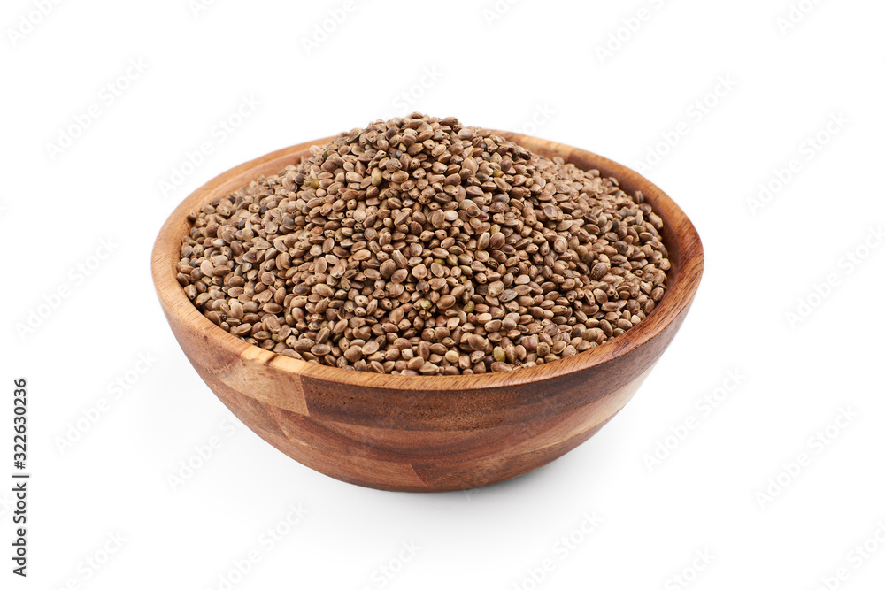 Hemp seeds in wooden bowl, isolated. Hemp seeds in wooden bowl, isolated.