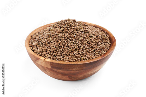 Hemp seeds in wooden bowl, isolated.
