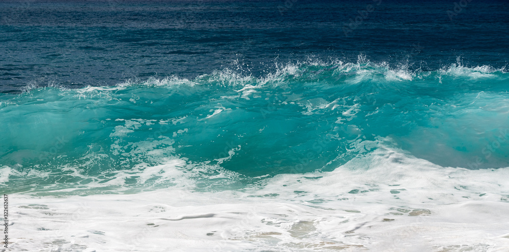 Frozen motion of water droplets at the crest of ocean waves off the coast of Hawaii Frozen motion of water droplets at the crest of ocean waves off the coast of Hawaii