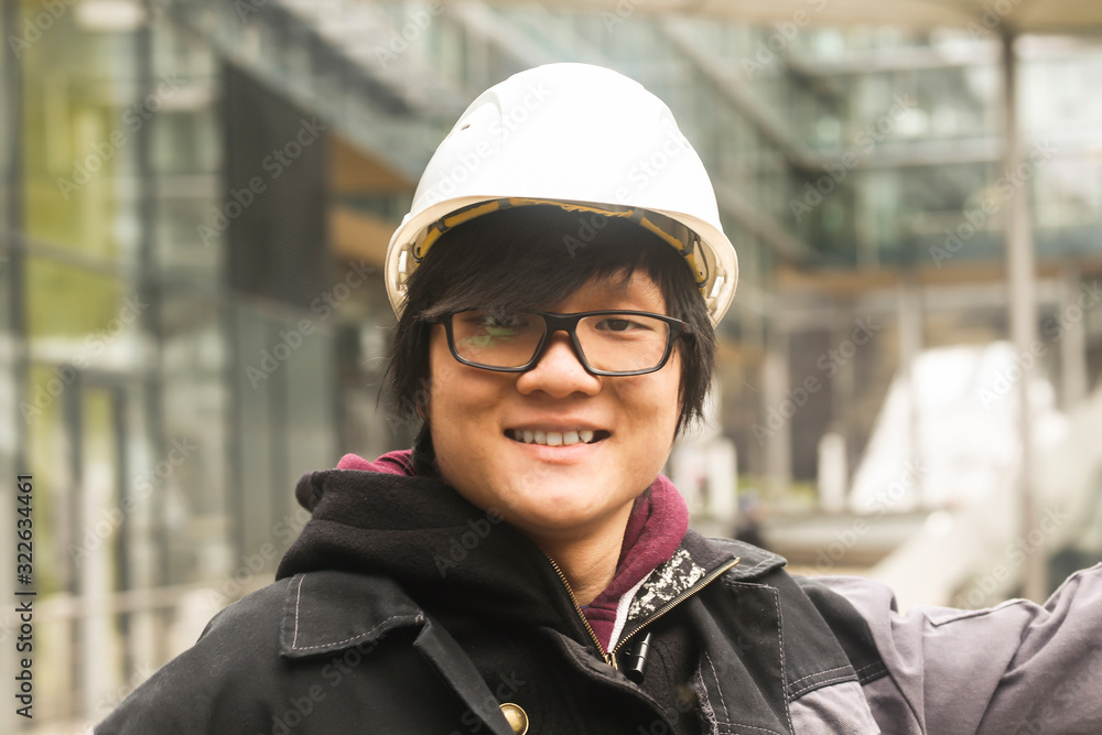 young man outside with helmet looking young man outside with helmet looking