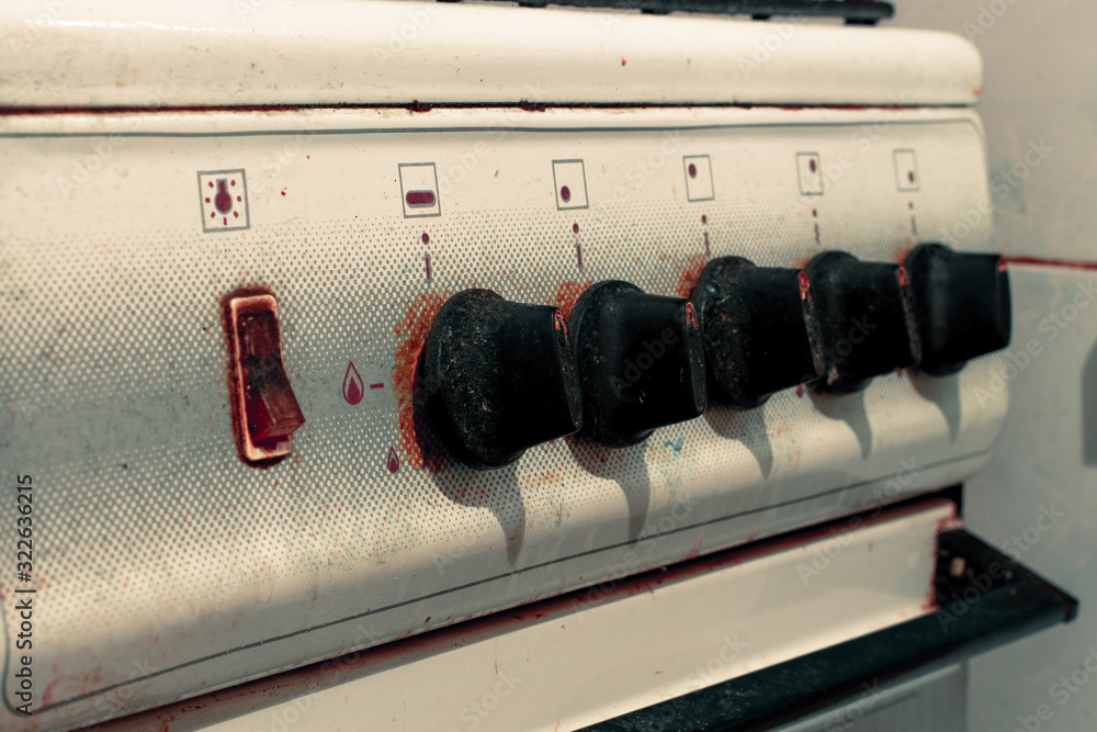 Control switch of an old gas stove. Five manual gas switches on an old