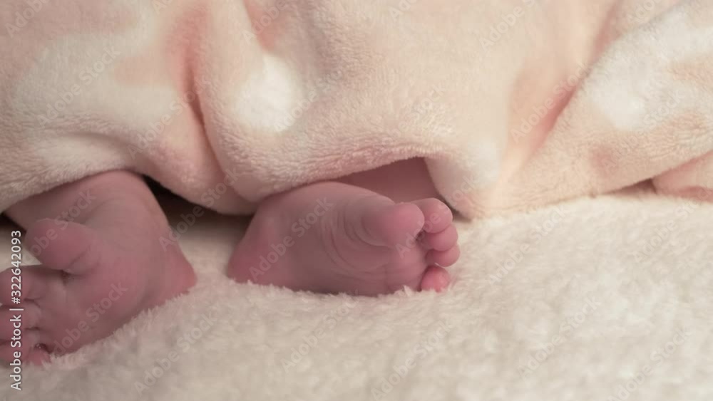 Beautiful Baby newborn is lying in bed and shows hands and feet, mother fandles with baby and covers her up with a cosy coverlet,4k 60p Apple ProRes422, with external Atoms recorder Beautiful Baby newborn is lying in bed and shows hands and feet, mother fandles with baby and covers her up with a cosy coverlet,4k 60p Apple ProRes422, with external Atoms recorder