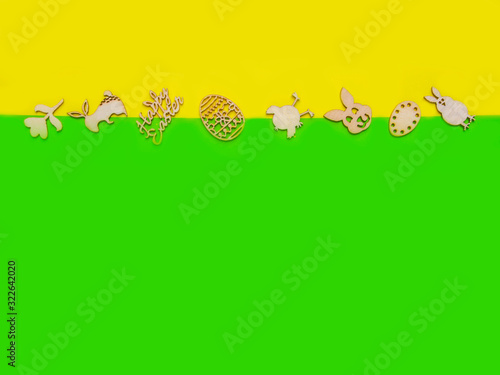 Easter wooden decoration frame against a yellow festive background  copy space