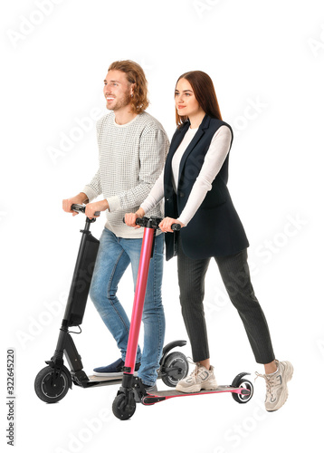 Young couple with kick scoo...