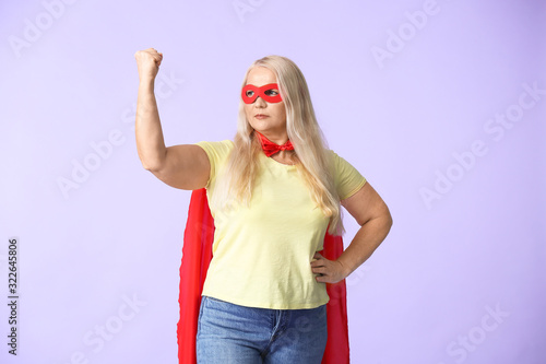 Woman in superhero costume ...