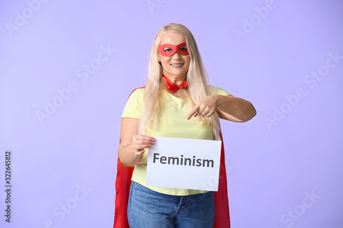 Woman in superhero costume ...