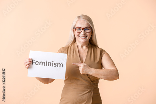 Woman holding paper with wo...