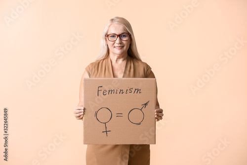 Lady holding cardboard with...