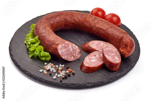 Smoked pork sausage ring, isolated on white background photo