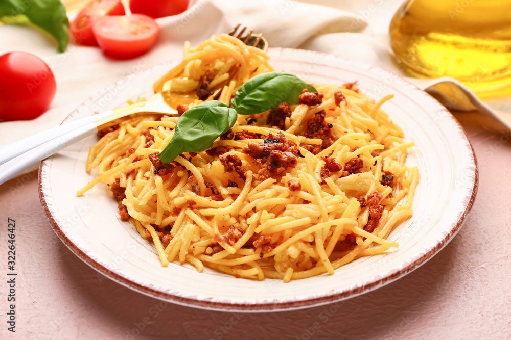 Plate with tasty pasta bolognese on table