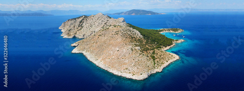 Fototapeta Naklejka Na Ścianę i Meble -  Aerial drone ultra wide photo of paradise small island of Moni visited by sail boats and yachts with turquoise clear seascape, Aegina island, Saronic gulf, Greece