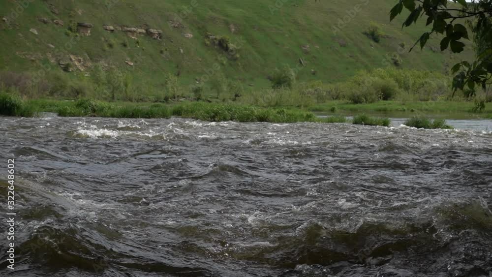 Powerful stream of river rapids. Slow motion 240 fps Powerful stream of river rapids. Slow motion 240 fps