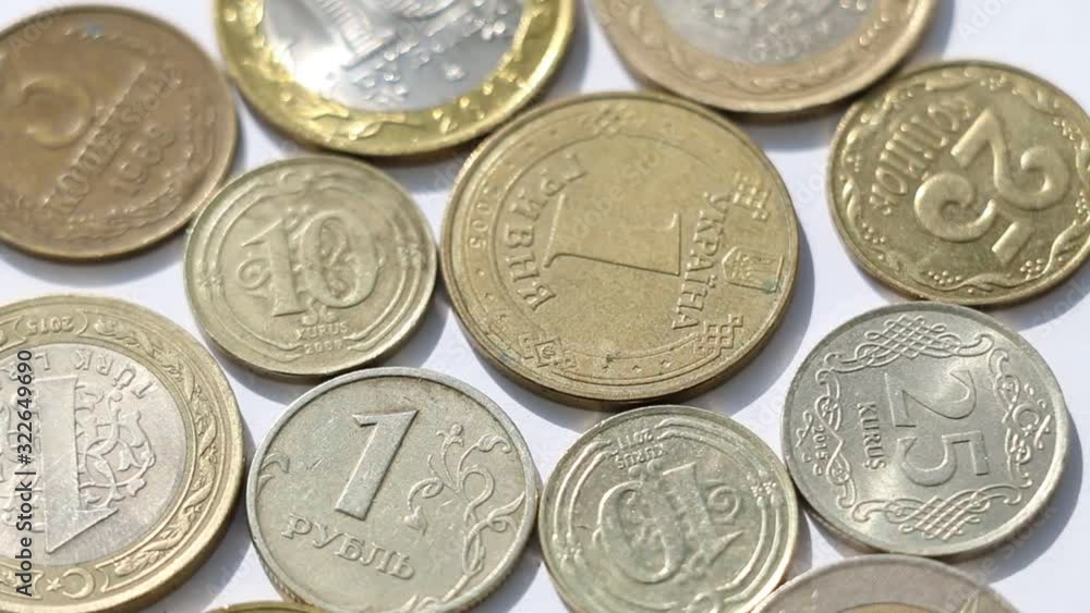 Rotating metal coins of different countries Rotating metal coins of different countries