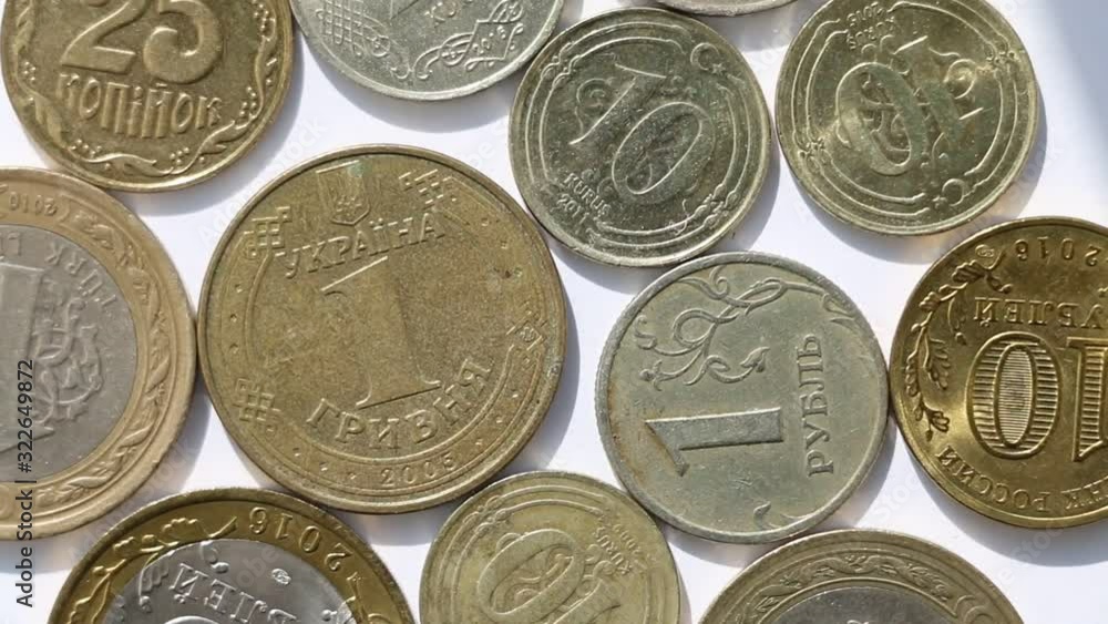 Rotating metal coins of different countries Rotating metal coins of different countries