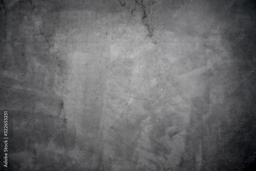 Dark grunge concrete texture with vignette as a background